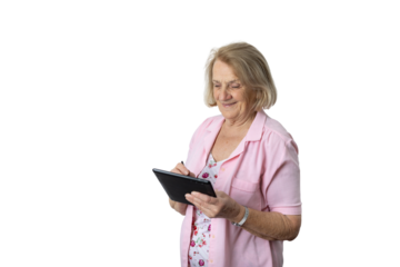 Senior woman smiling using digital tablet online
