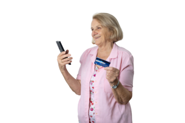 Senior woman doing online shopping holding smartphone and credit card