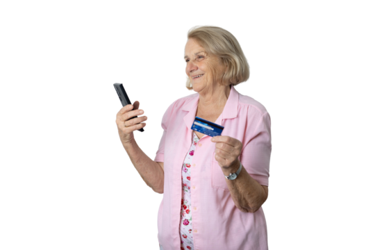 Senior woman doing online shopping holding smartphone and credit card - Powered by Adobe