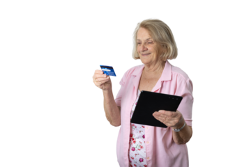 Senior woman holding credit card and tablet online shopping