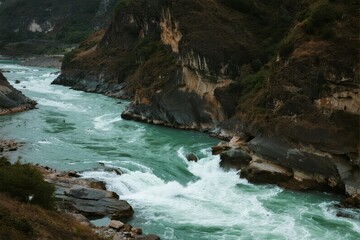 Rapid river flowing through a narrow canyon with rocky cliffs and turquoise water