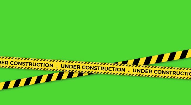 Cautionary yellow and black striped tape declaring under construction across a vibrant green background symbolizing ongoing work and development projects