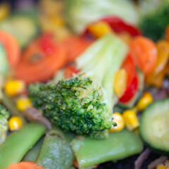 Mixed fresh veggies sizzling on skillet for recipe and healthy lifestyle design, 1:1.