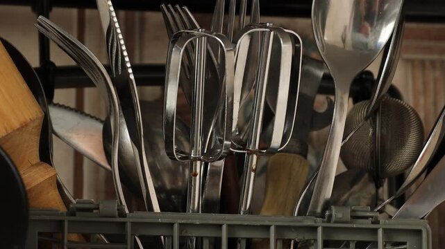 A collection of kitchen utensils arranged neatly in a wicker basket