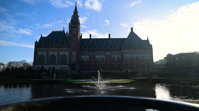 Reflection the beautiful Peace Palace building and most visited building in The Hague and seat of the International Court of Justice at Autumn season