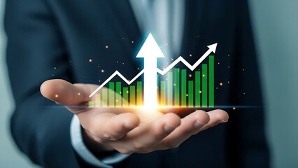 Hand holding glowing graph showing business growth and financial success