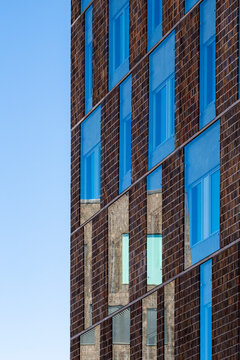 Architecture facade integrating geometry, reflection and pattern, where minimalism and contrast enhance the structure supported by clean lines and geometric design