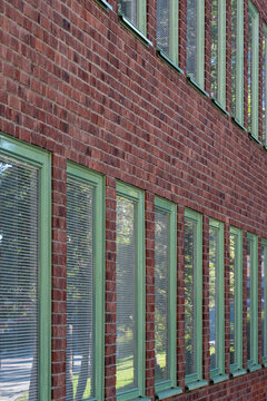 A refined architecture facade using geometry and reflection to build pattern and minimalism, adding contrast and structure revealed by clean lines and geometric design