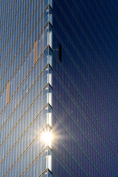 Architecture facade with geometry and reflection forming a pattern that enhances minimalism and contrast through structure shaped by clean lines and geometric design