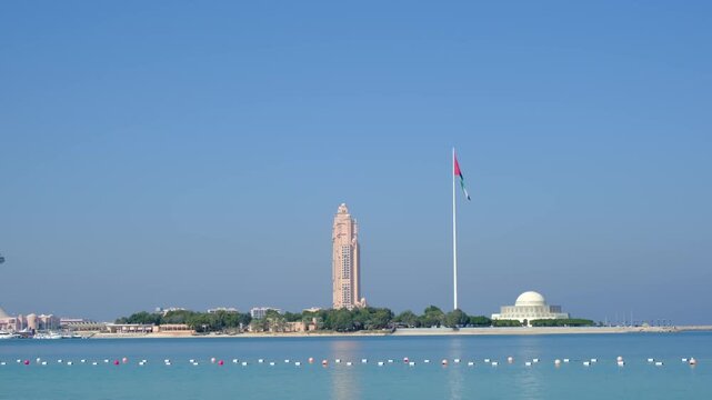 Bright daylight reveals Etihad Towers rising over Abu Dhabi, clean lines reflecting sun, modern silhouette shaping strong city mood, clear sky framing powerful architecture in calm summer air.