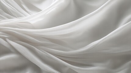 Elegant white fabric with smooth wavy folds. Light grey cloth texture as background for design. Concept of luxury material or soft natural textile. Trend color year 2026.