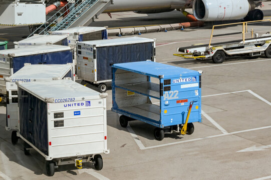 Denver, Colorado, USA - 4 June 2025: Baggage trolleys used by United Airlines at Denver International Airport.