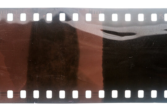 Dusty and grungy 35mm film texture or surface. Perforated scratched camera film isolated on white background. - Powered by Adobe