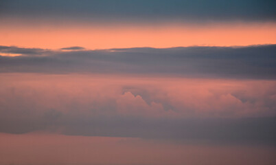 Dreamlike late afternoon sky illuminated by radiant sunset glow and color