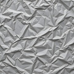 Obraz premium Crumpled Gray Paper Texture with Wrinkles and Folds Creating a Unique Surface Pattern