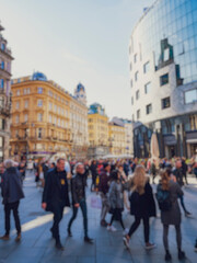 Fototapeta premium Crowd of anonymous people walking on busy city street 