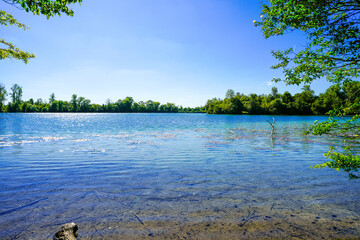 View of the Langwieder lake district and the surrounding landscape. Nature by the lake near Munich in Bavaria.
