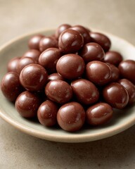 Chocolate Covered Raisins in a Ceramic Bowl Displayed