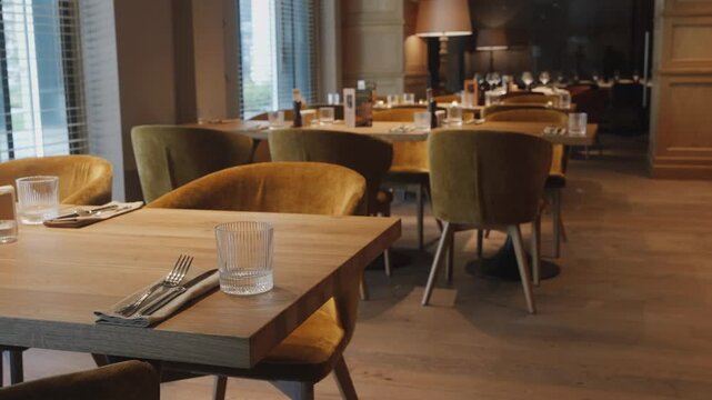 Stylish restaurant prepared for guests, Sophisticated dining area with prepared table settings