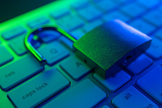 Focus on cyber security with an open padlock on a keyboard - Powered by Adobe