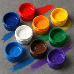 Vibrant collection of opened paint containers arranged artfully on a textured surface