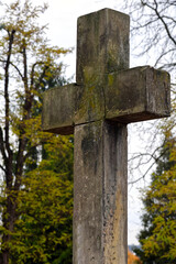 Weathered Stone Cross with Moss and Cracks