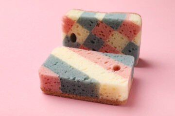 Clean kitchen sponges on pink background, closeup
