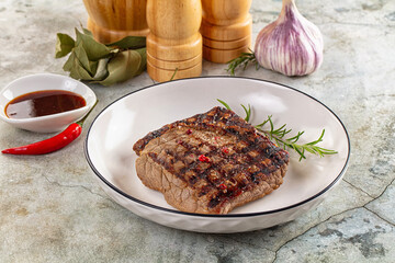 Grilled juicy beef steak with pepper