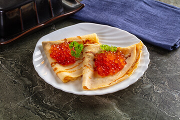 Russain traditional pancakes with red caviar