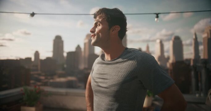 Sweaty Man Finishes Intense Rooftop Workout, Catching His Breath and Stretching, Urban Outdoor Fitness, Cardio Endurance, and Post exercise Recovery on a Scenic City View Terrace