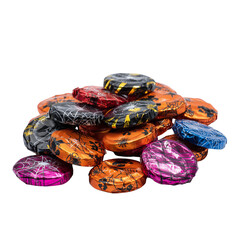 Assortment of vibrant halloween chocolates with spider and web designs piled up