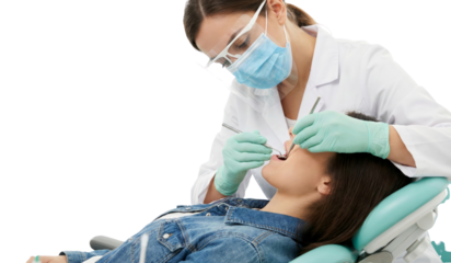 Professional woman dentist providing specialized dental care to a young female patient with