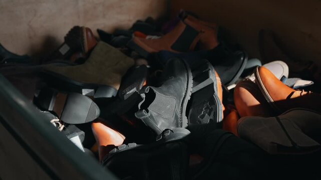 pile of used shoes gathered for rubber recovery