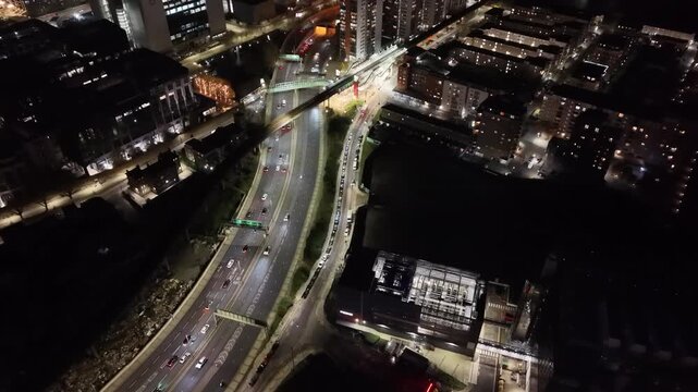 Everning East London highway drone push in over colourful apartment building