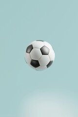 Obraz premium Classic black and white soccer ball floating in mid-air against a clean, light blue background. Concept of sport, game, and athleticism with copy space