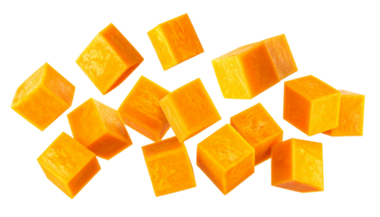 Fresh diced butternut squash or pumpkin pieces falling and scattered, isolated on a white background