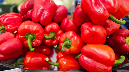 Fresh red pepper on market counter.