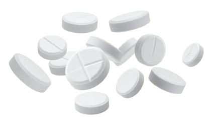 Collection of white round pills with a cross inscribed on them, scattered in the air