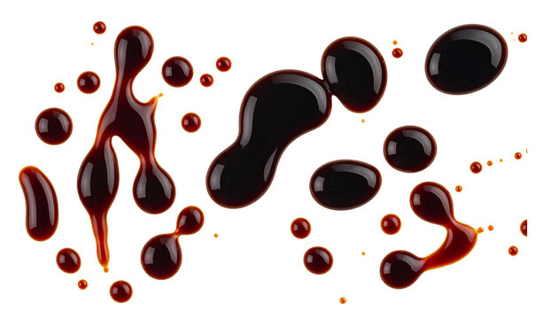 Drops of traditional soy sauce or balsamic vinegar splashed and isolated on a white background