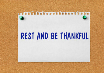 An advertisement &laquo;Rest and be thankful&raquo; on a piece of paper attached to a notice board