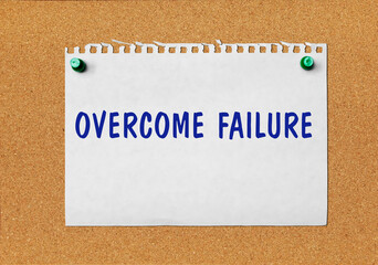 An advertisement &laquo;Overcome failure&raquo; on a piece of paper attached to a notice board