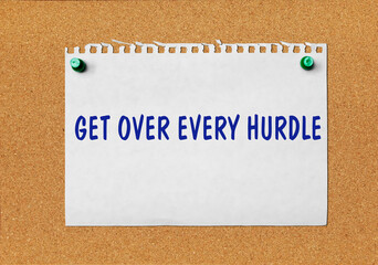 An advertisement &laquo;Get over every hurdle&raquo; on a piece of paper attached to a notice board