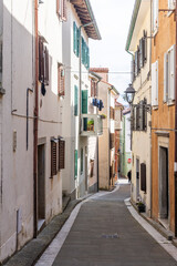 Naklejka premium Muggia harbor with colorful houses on the Adriatic coast, Italy