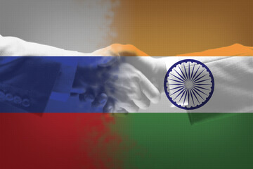 Strategic partnership: A handshake overlaid on the flags of Russia and India, symbolizing their enduring diplomatic, economic, and military cooperation and warm friendship