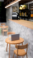 Cafe workspace with laptop and counter view 3D render