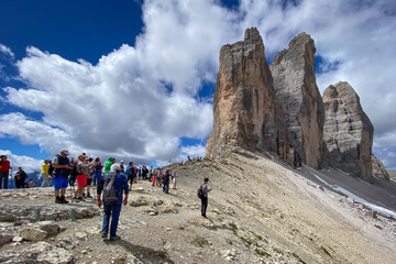 Group of hikers at Tre Cime trail below Cima Grande, Italy