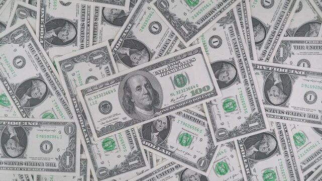 Close-up Of One Dollar Bills Lying Around Haphazardly.