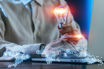 Creative thinking in digital finance with light bulb concept and currency symbols