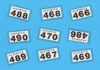 Vintage raffle tickets on a bright blue background with space for copy or text.