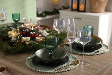 Festive table setting with Christmas decor indoors, closeup
